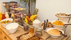 A buffet with various food items and condiments. - Baggot Court Townhouse (Dublin)