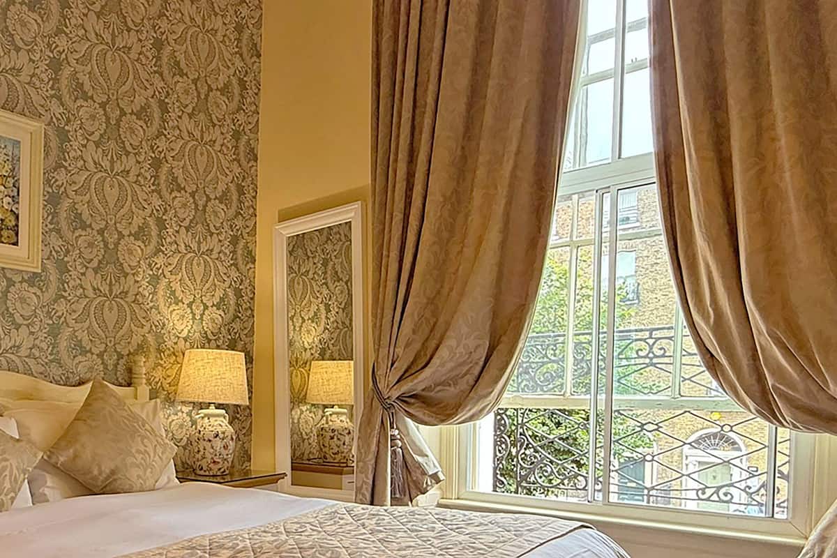 Down comforters, desk, blackout drapes, iron/ironing board