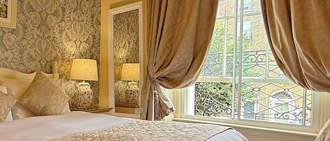 Down comforters, desk, blackout drapes, iron/ironing board