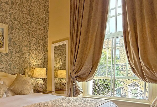 Down comforters, desk, blackout drapes, iron/ironing board