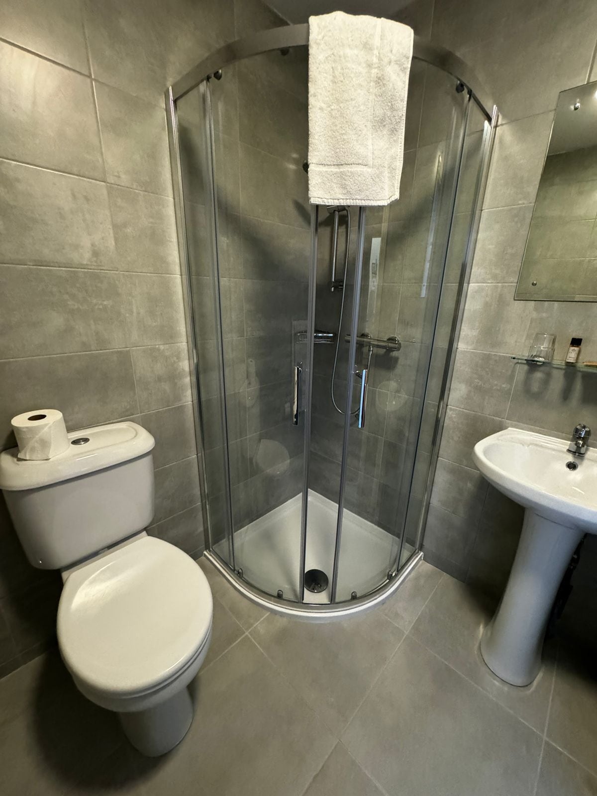 shower, free toiletries, hair dryer, towels