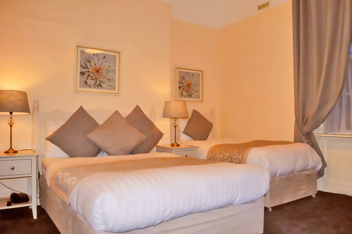 Down comforters, desk, blackout drapes, iron/ironing board