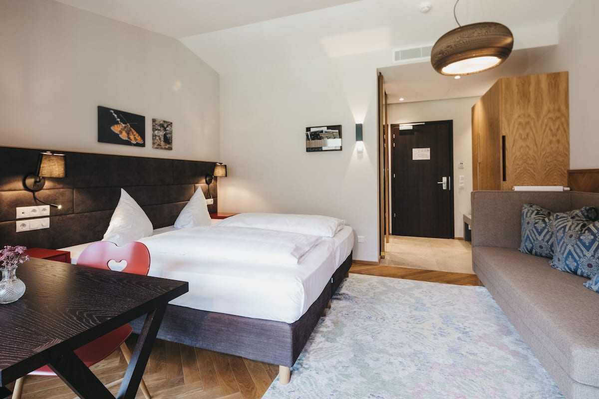 Superior Double Room | Living area | 20-inch flat-screen TV with satellite channels, TV, toys