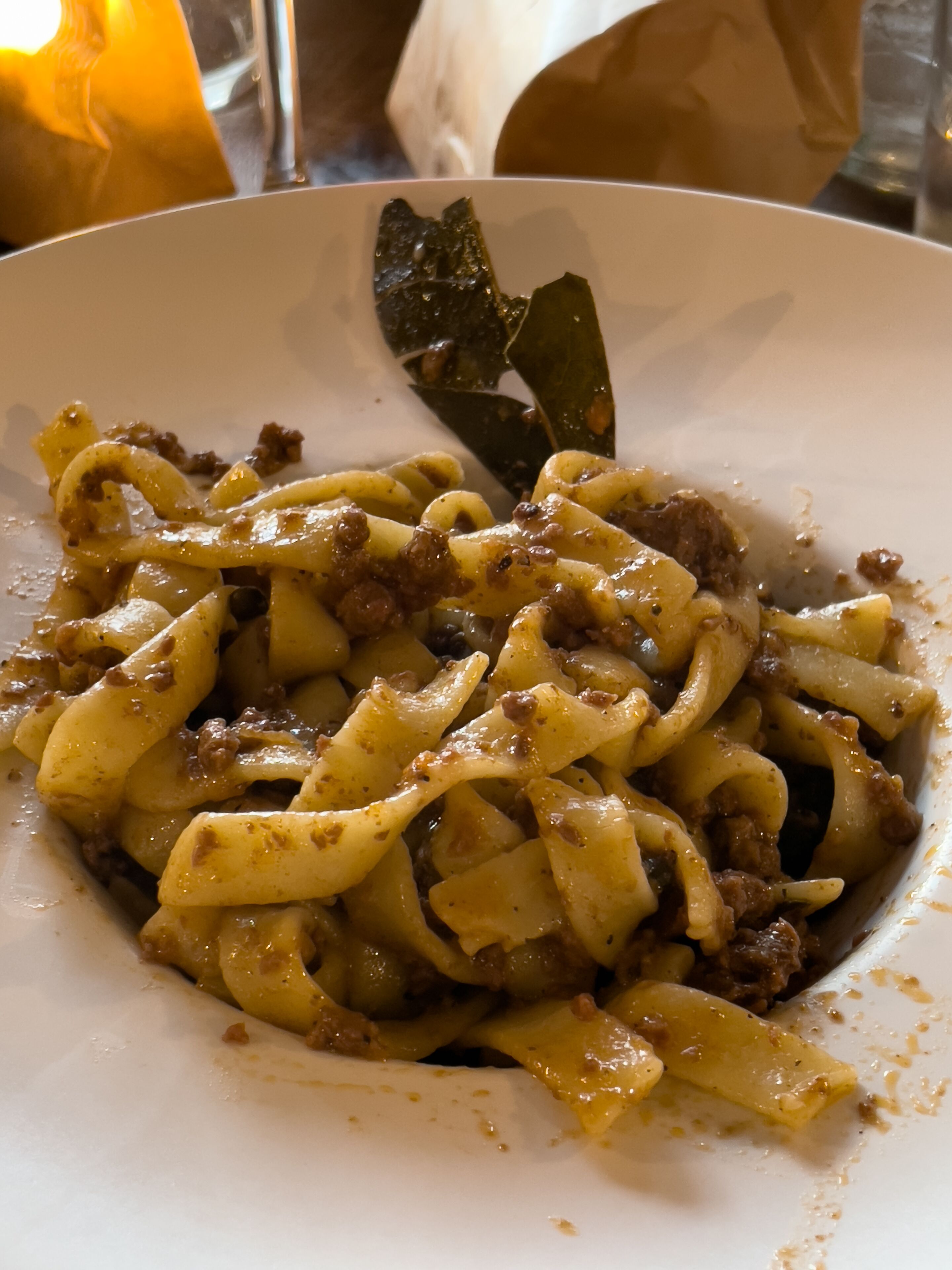 A plate of pasta with a meat sauce.
