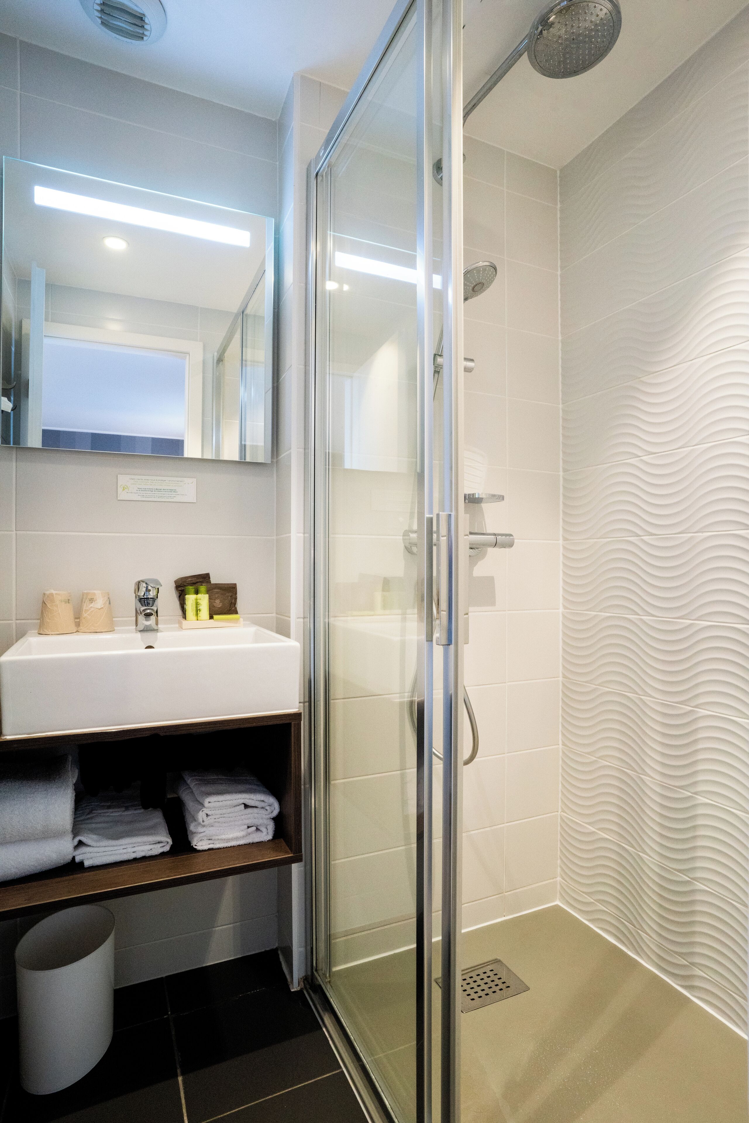 superior triple room | bathroom | shower, hair dryer, towels