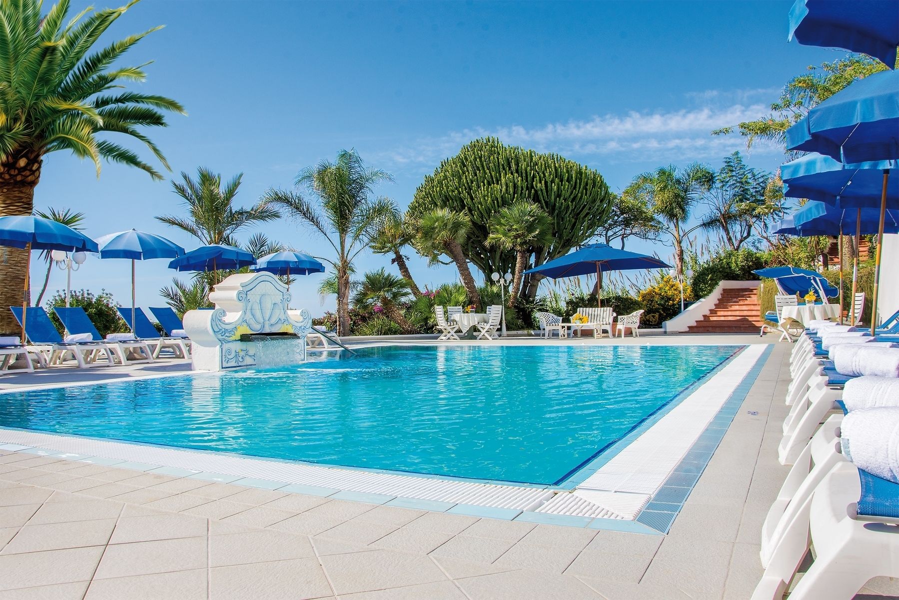 seasonal outdoor pool, open 8:00 am to 7:00 pm, pool umbrellas