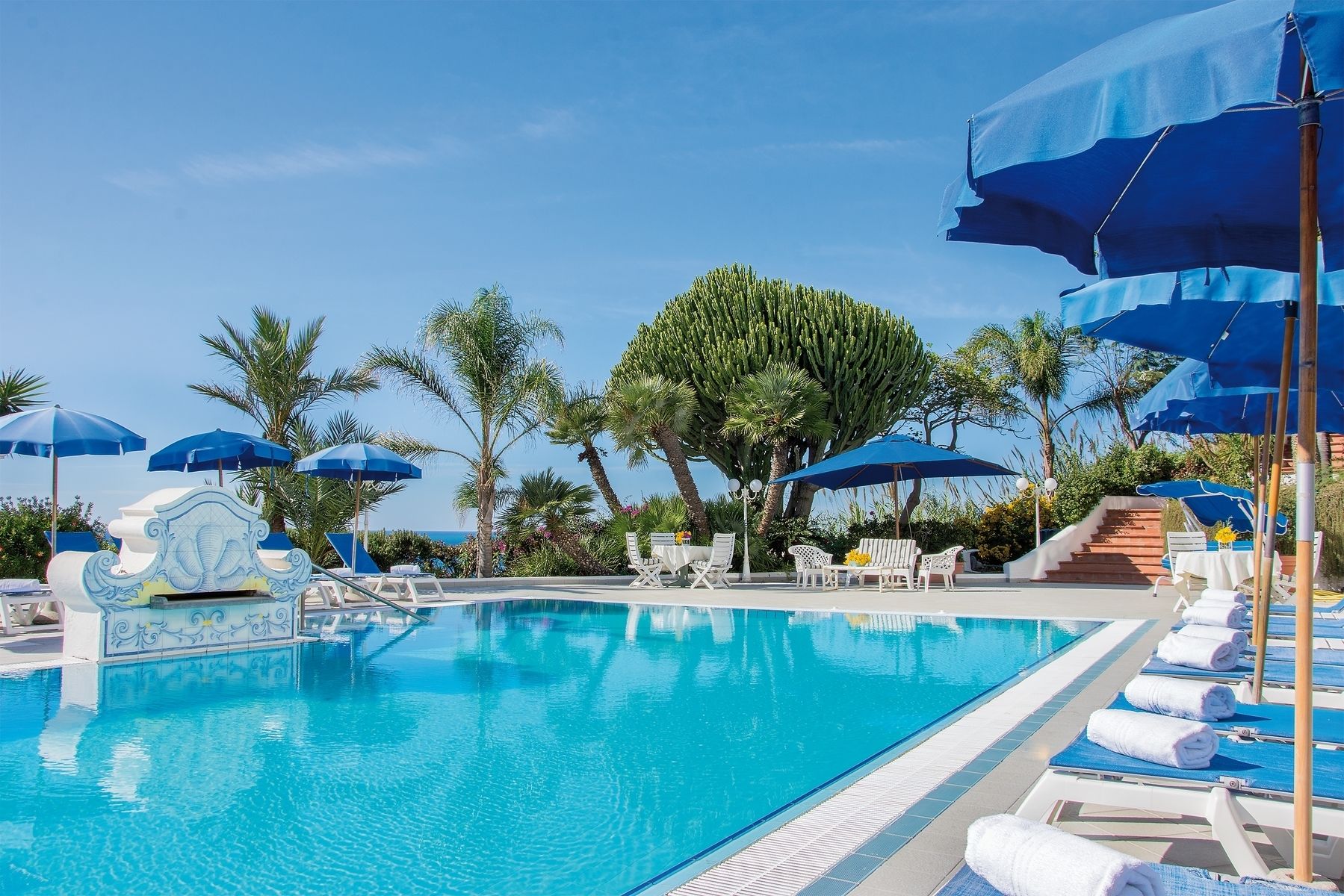 seasonal outdoor pool, open 8:00 am to 7:00 pm, pool umbrellas