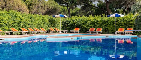 Seasonal outdoor pool, pool umbrellas, pool loungers