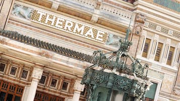 A building facade with the name "THERMAE" prominently displayed.