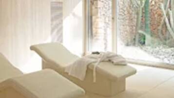 Relax in a serene space with an outdoor area and a single lounge chair.