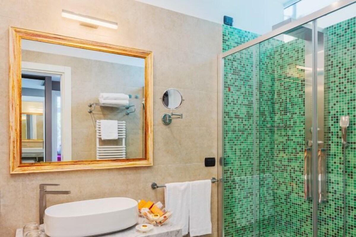 Bathroom | Shower, rainfall showerhead, eco-friendly toiletries, hair dryer