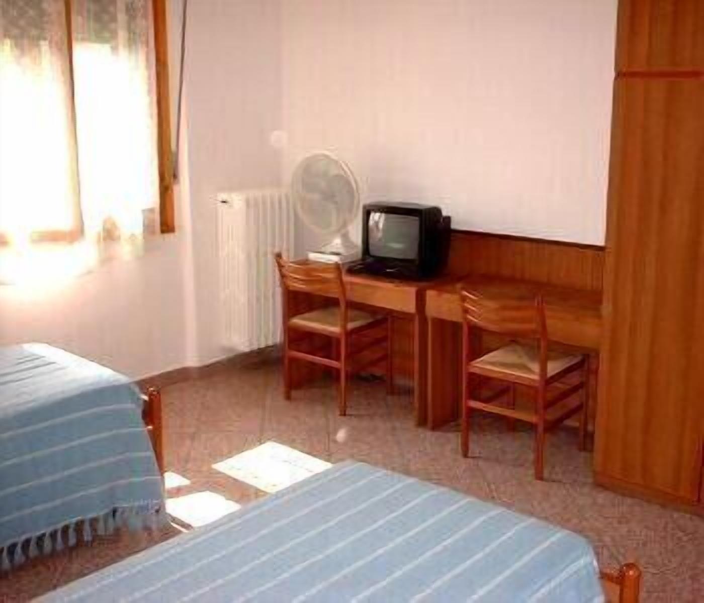 economy triple room, shared bathroom | hypo-allergenic bedding, select comfort beds, desk, soundproofing