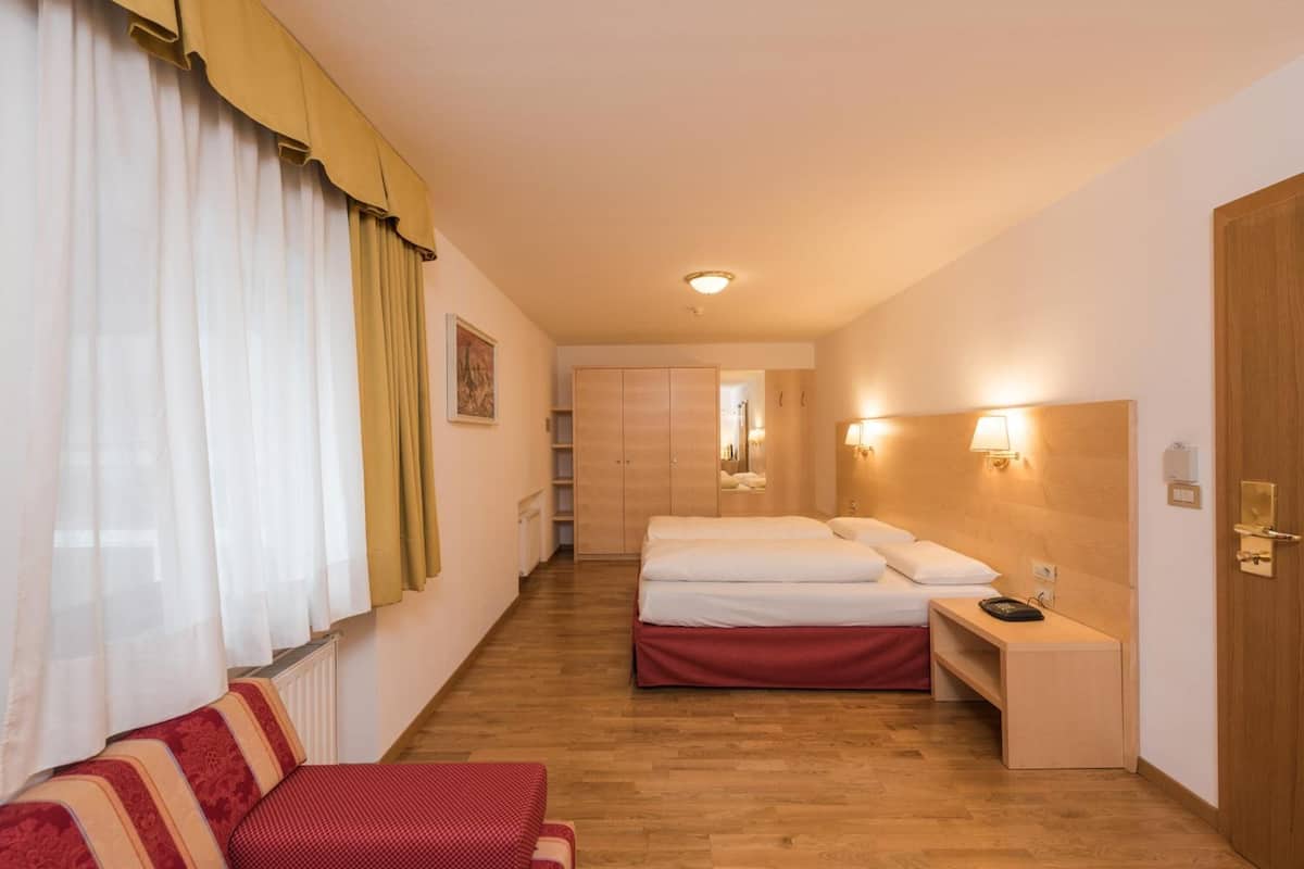 hypo-allergenic bedding, down duvets, in-room safe, desk