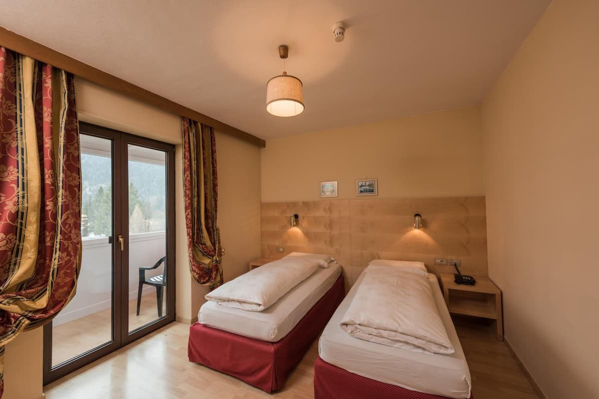 hypo-allergenic bedding, down duvets, in-room safe, desk