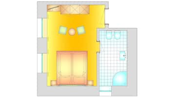 Plano de una habitación de hotel que muestra una cama, un baño y una pequeña zona de estar con dos sillas y una mesa.