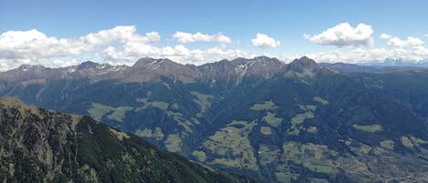 A mountainous landscape with rocky terrain and a clear sky.