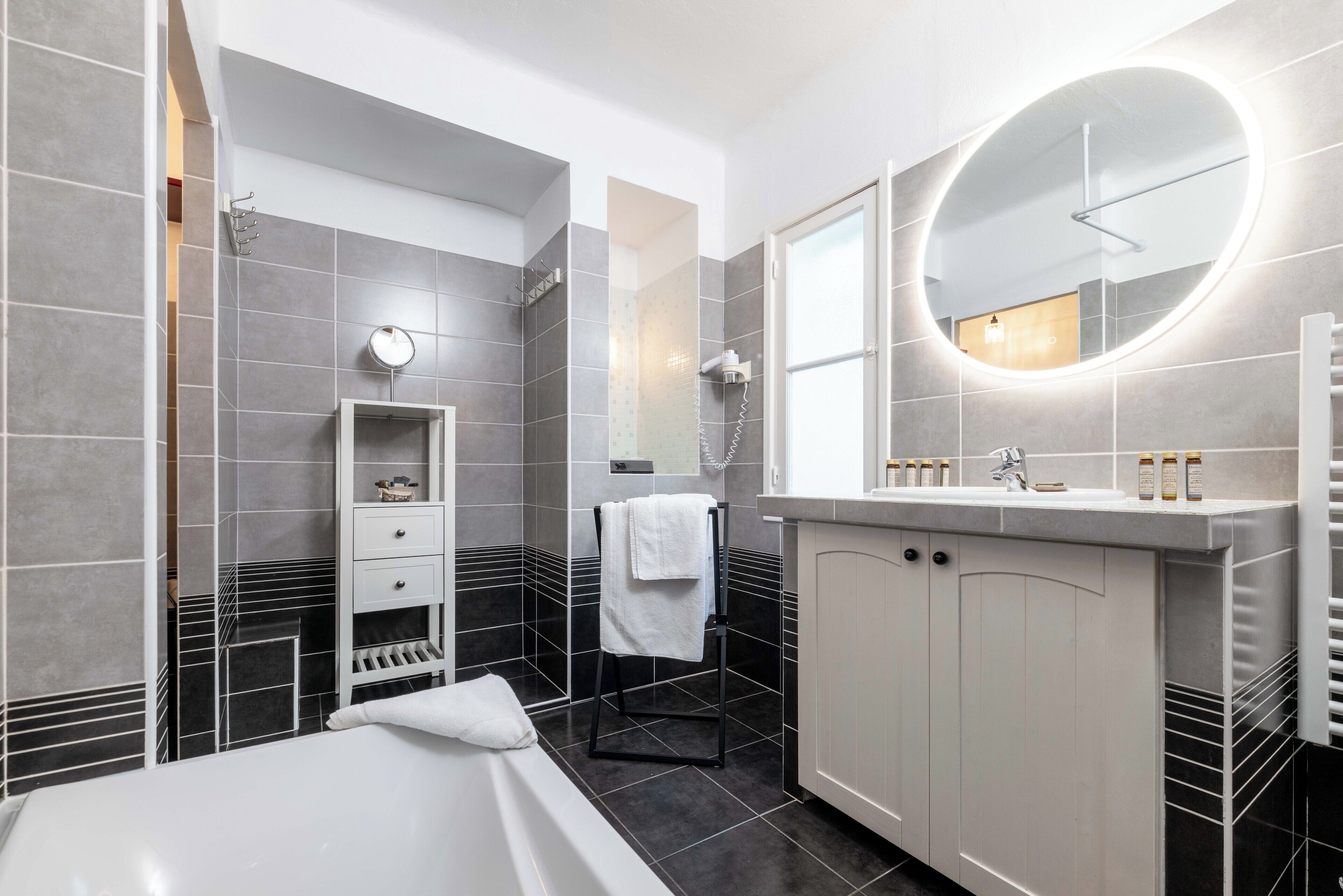 suite, garden view | bathroom | free toiletries, hair dryer, towels