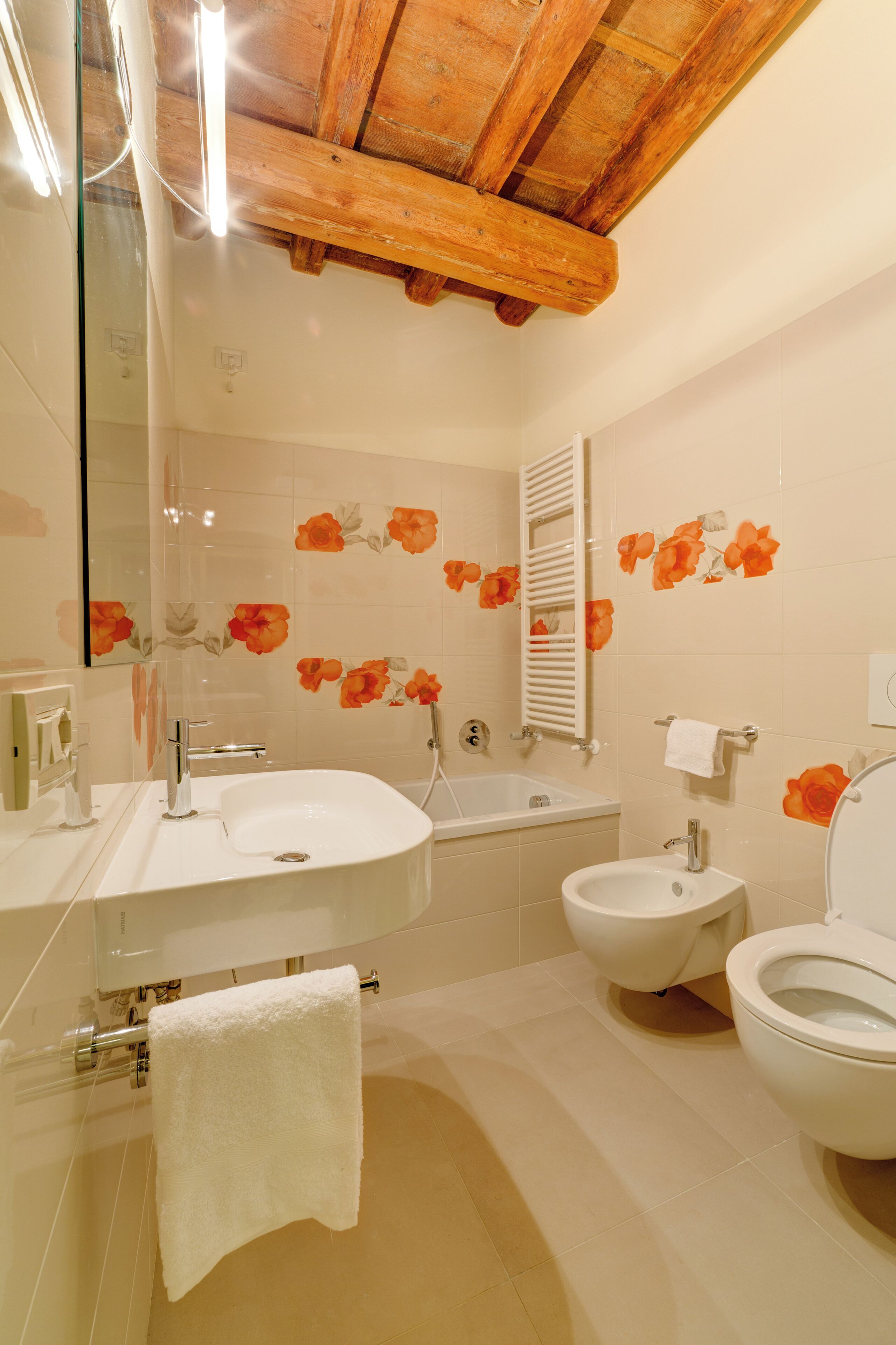 A bathroom with a sink, bathtub, and toilet.