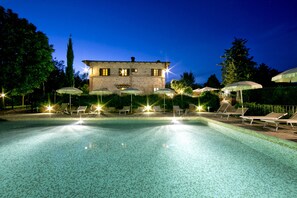 Seasonal outdoor pool, a rooftop pool, pool umbrellas, pool loungers