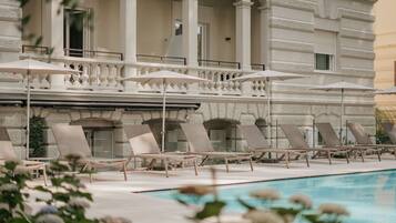 Seasonal outdoor pool, open 8 AM to 8 PM, pool umbrellas, sun loungers