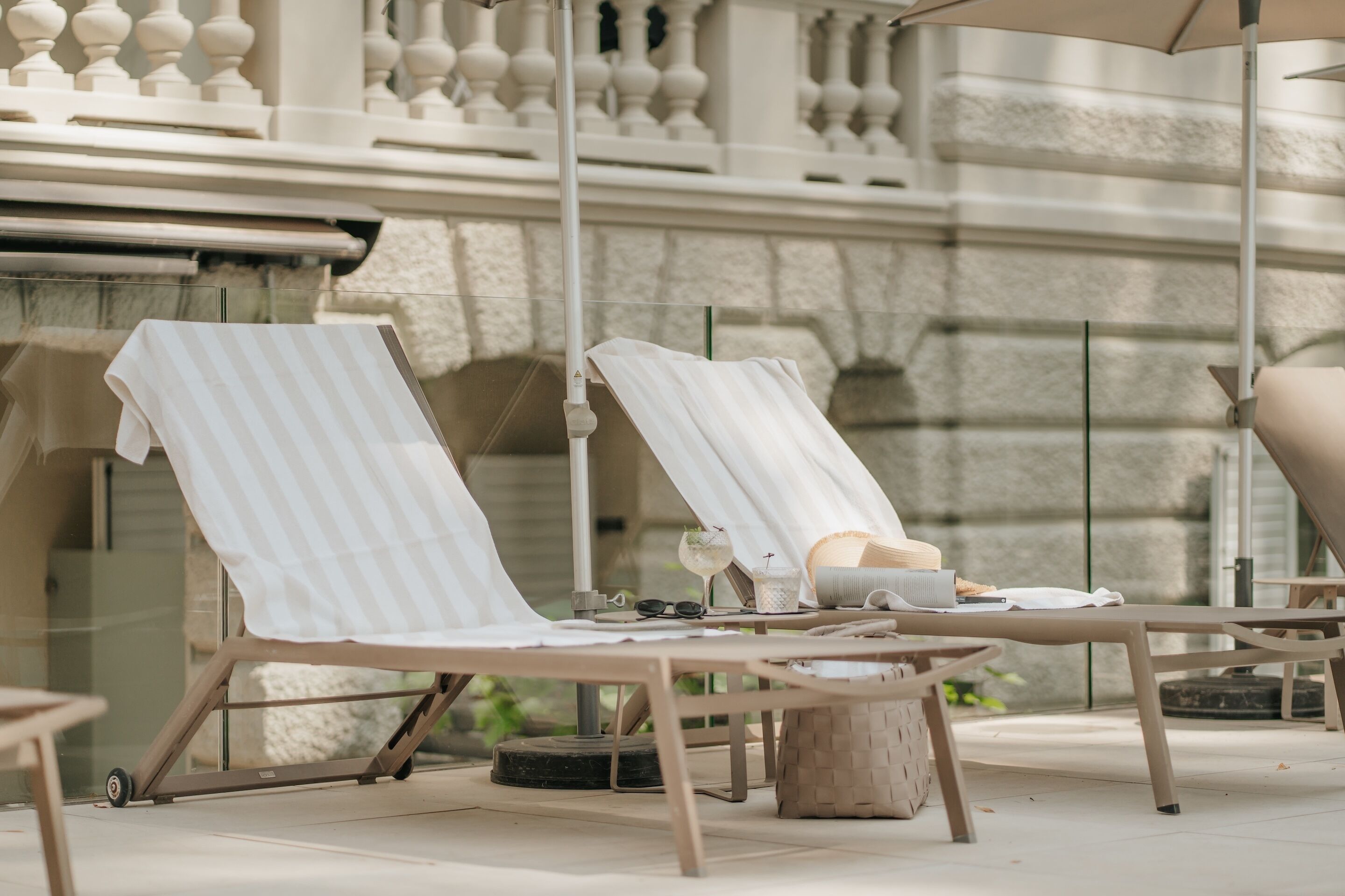 Seasonal outdoor pool, open 8 AM to 8 PM, pool umbrellas, pool loungers