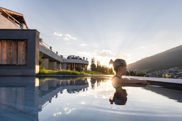 Indoor pool, outdoor pool, pool umbrellas, pool loungers