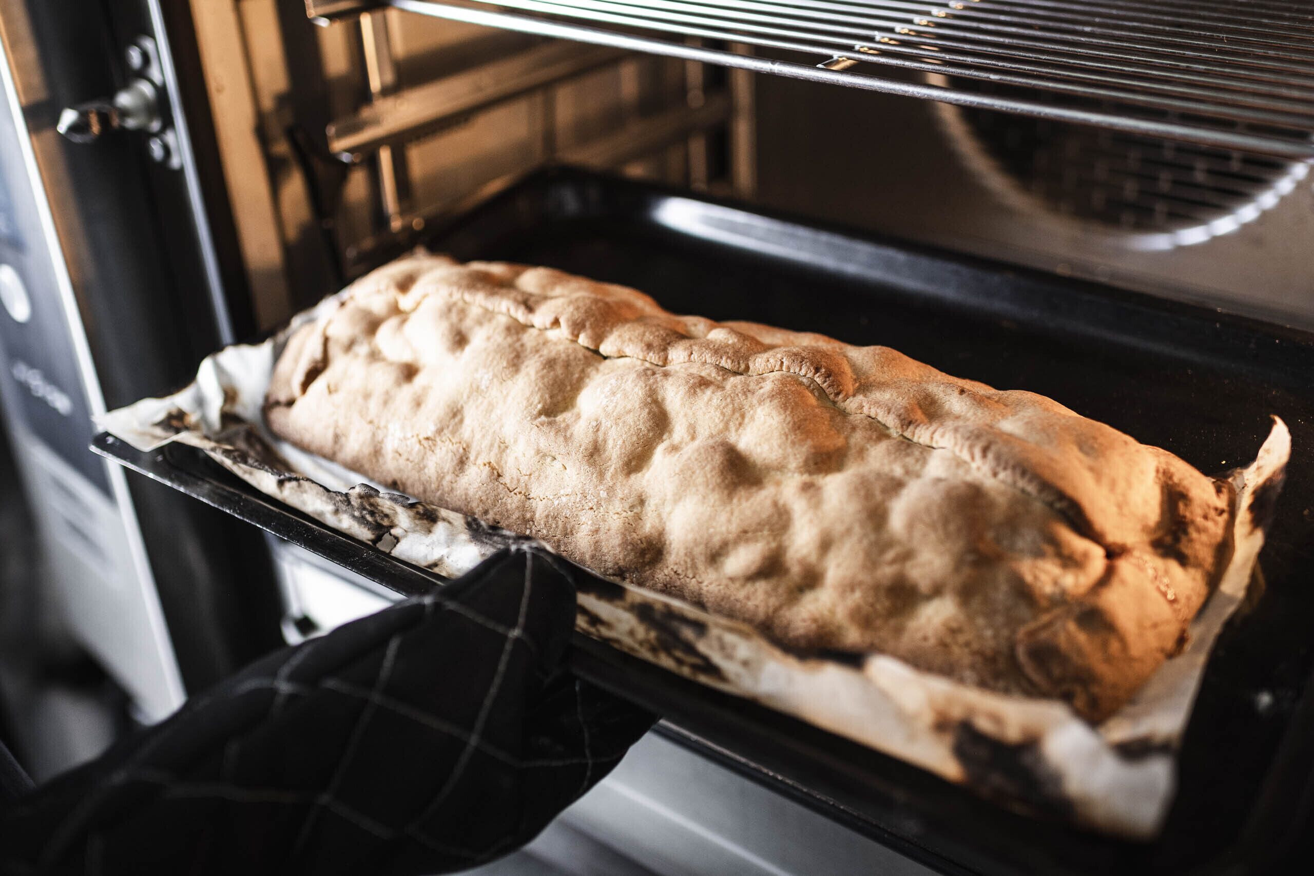 A loaf of bread baking in an oven.