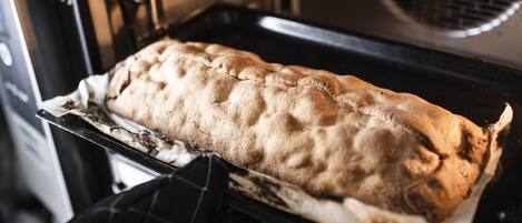 A loaf of bread baking in an oven.