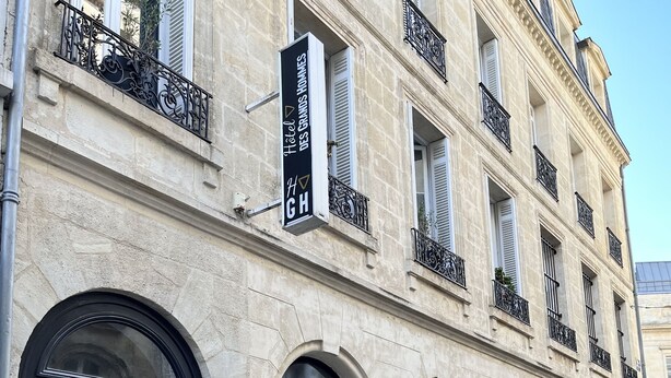 A hotel facade with multiple storefronts, including a visible sign for 'BRIT HOTEL' and 'Prévôt' awnings. - Hotel des Grands Hommes - Bordeaux Centre (Bordeaux)