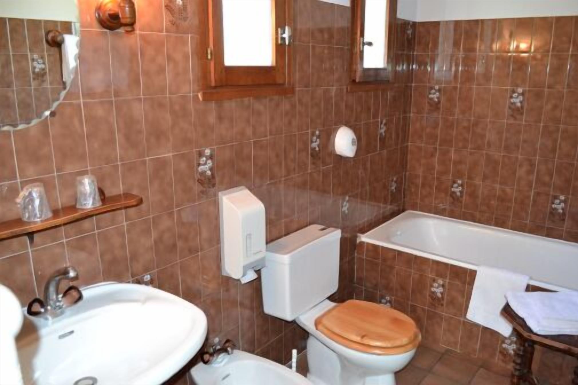 bathtub, free toiletries, hair dryer, towels