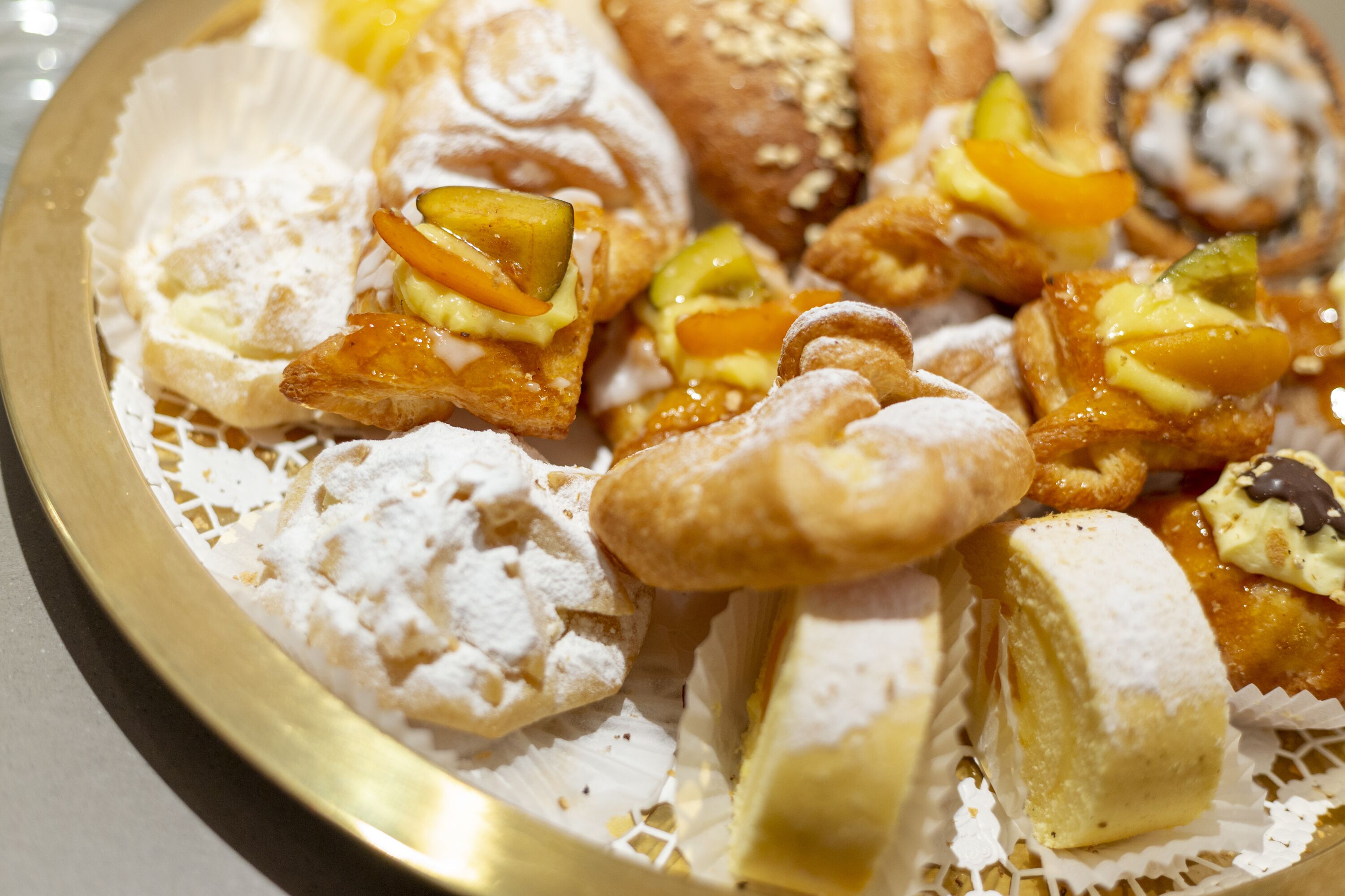 A variety of pastries and desserts on a plate.