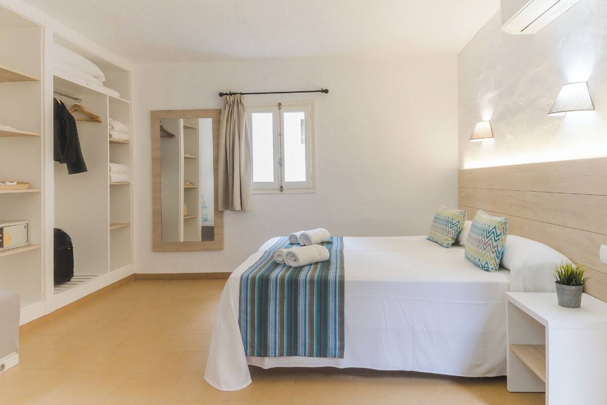 Desk, blackout drapes, bed sheets