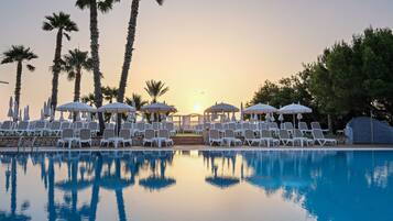 Outdoor pool, open 9 AM to 7 PM, pool umbrellas, sun loungers