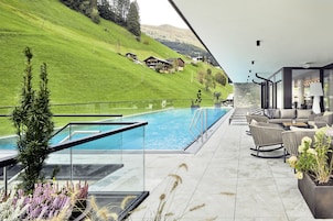 Seasonal outdoor pool, open 7:00 AM to 7:00 PM, pool umbrellas