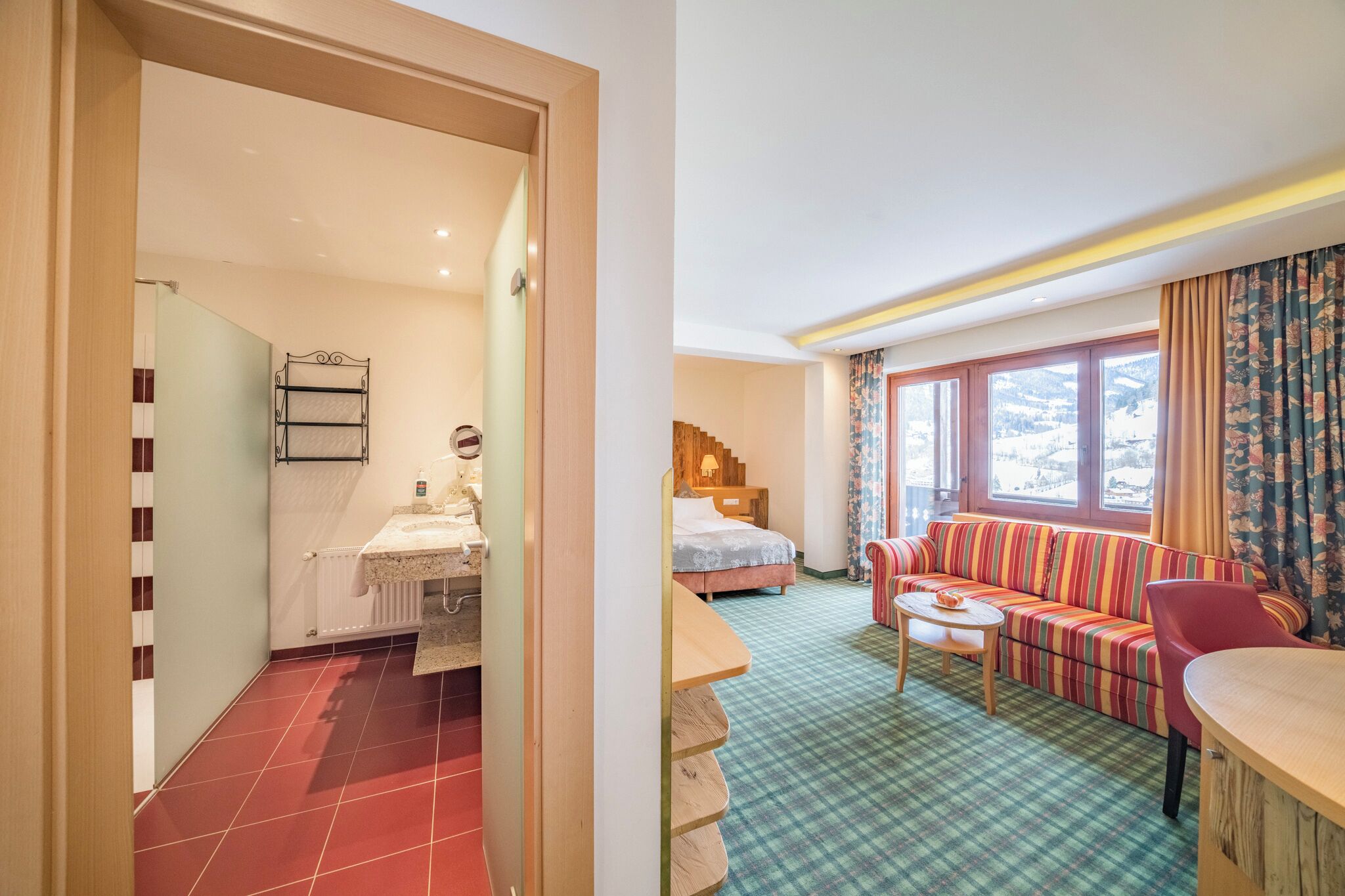 panoramic studio suite | living area | 50-inch flat-screen tv with satellite channels, ping pong, toys