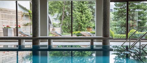 Indoor pool, pool umbrellas, sun loungers