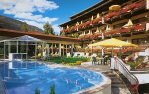 Indoor pool, outdoor pool, pool umbrellas, pool loungers