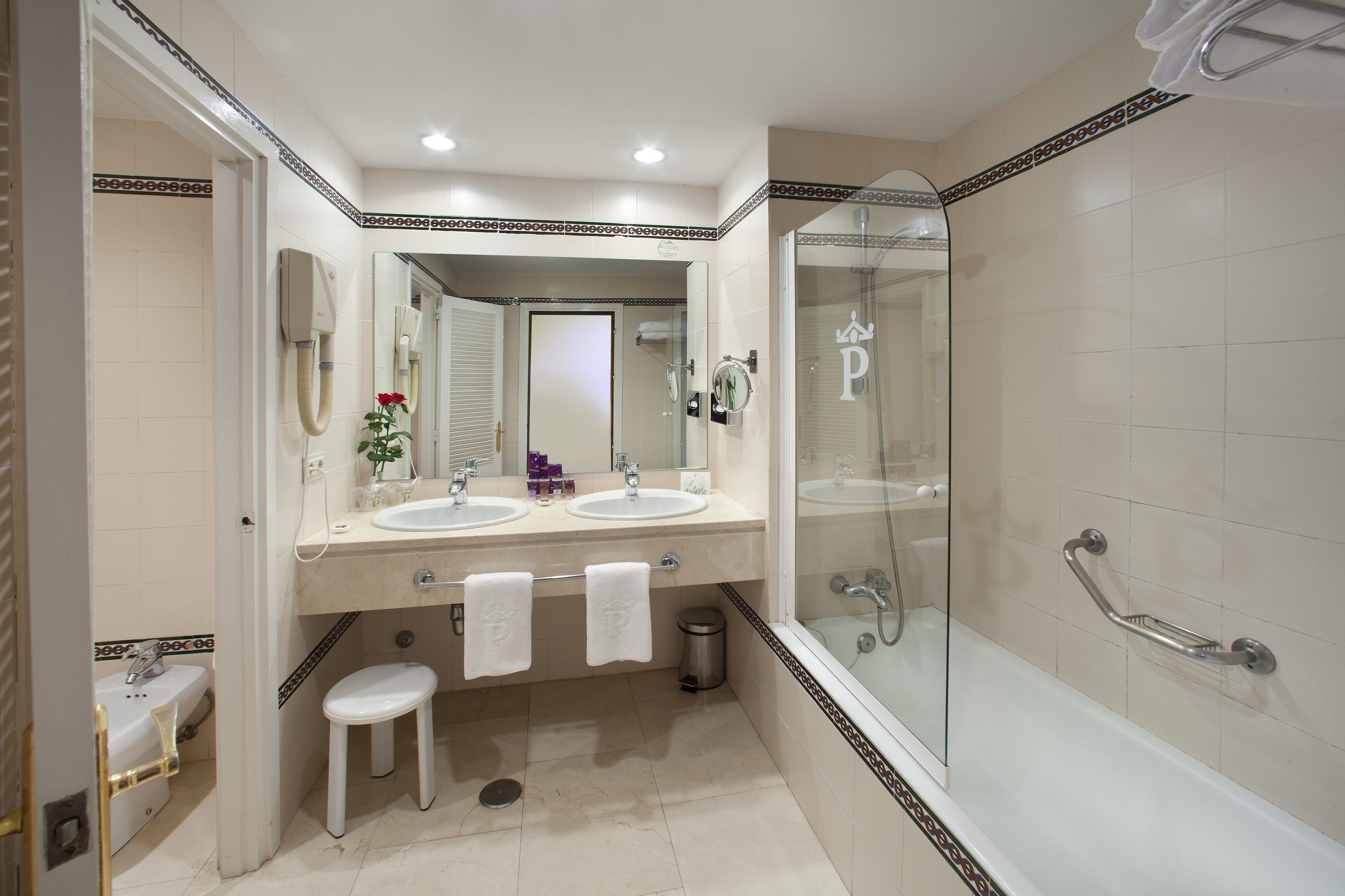 eco-friendly toiletries, hair dryer, bidet, towels