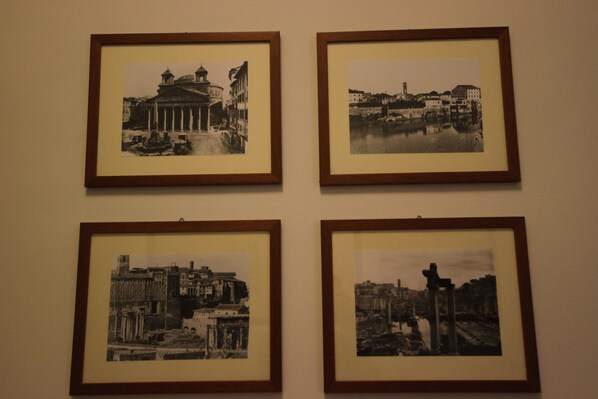 Four framed black and white photographs of historical buildings and structures. - Tourist House (Rome)