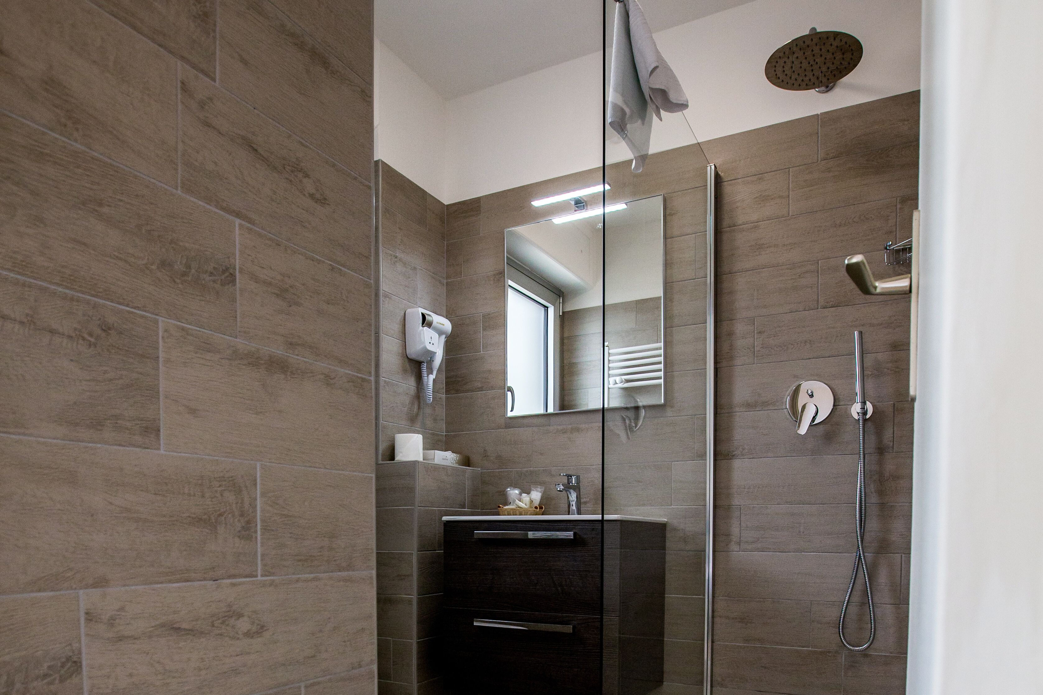 deep-soaking bathtub, rainfall showerhead, free toiletries, hair dryer