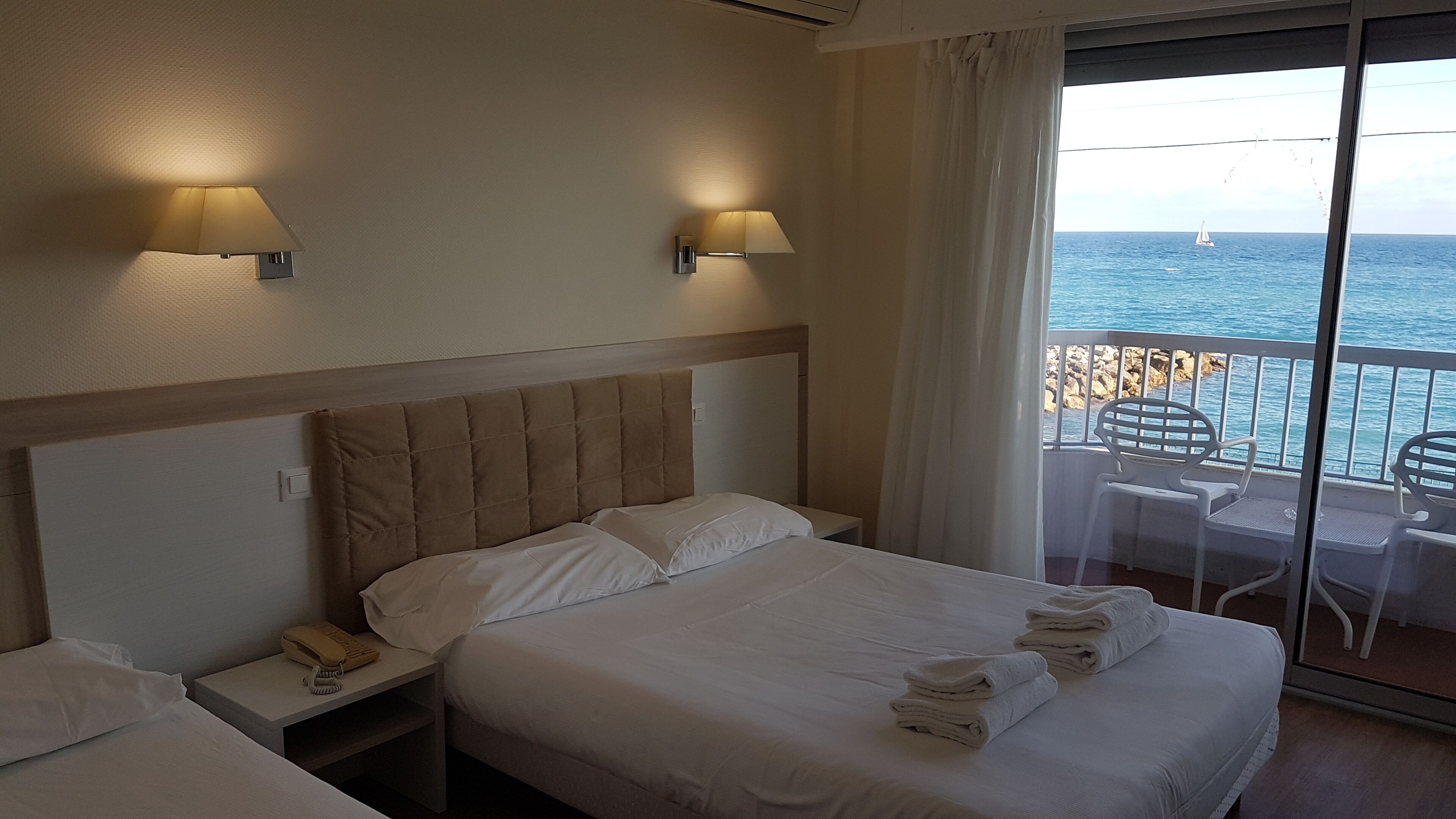 triple room, sea view | 1 bedroom, minibar, in-room safe, blackout curtains