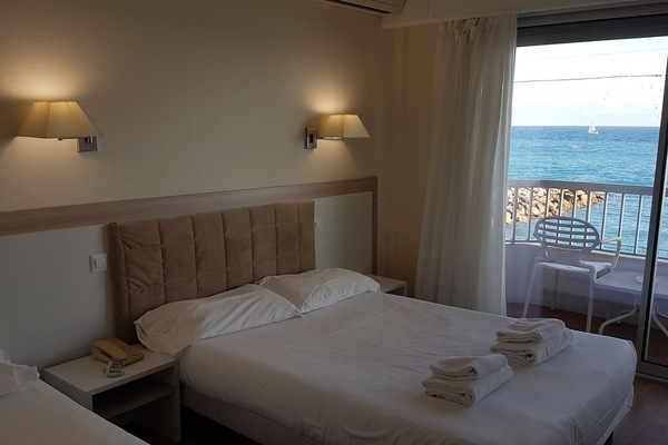 Triple Room, Sea View | Pillowtop beds, minibar, in-room safe, desk