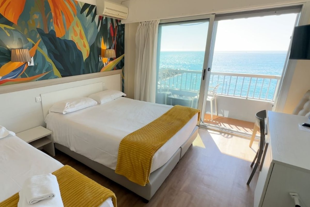 Triple Room, Sea View | Pillowtop beds, minibar, in-room safe, desk
