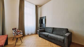 Superior Family Room | Living area | 54-cm flat-screen TV with cable channels, TV