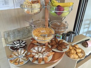 Indulge in a spread of international cuisine, featuring a variety of sweet and savory options.