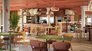 A restaurant with multiple tables and chairs, a bar area, and a large plant. - ibis Styles Annecy Le Vieux (Annecy)