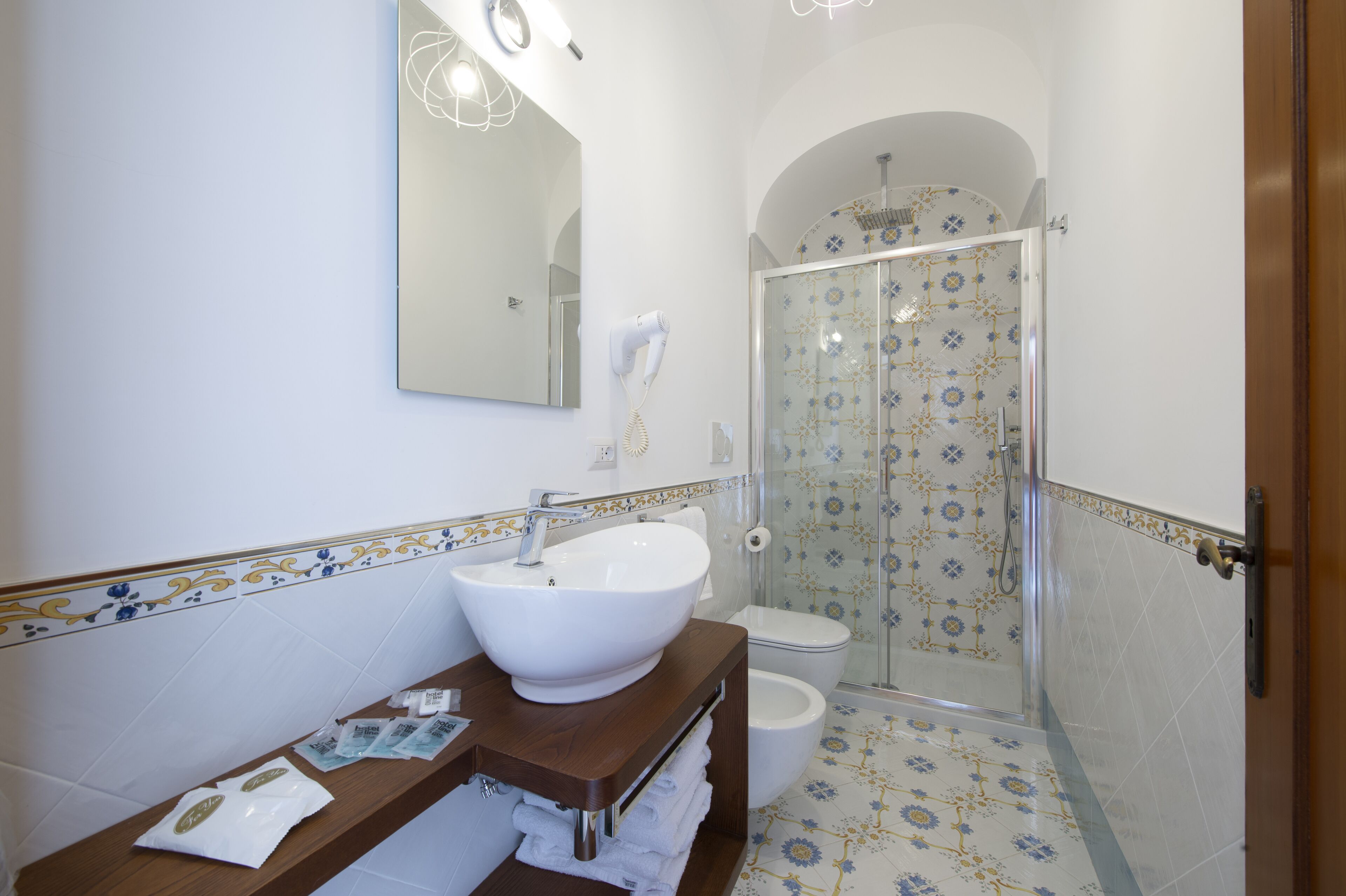 shower, rainfall showerhead, hair dryer, towels