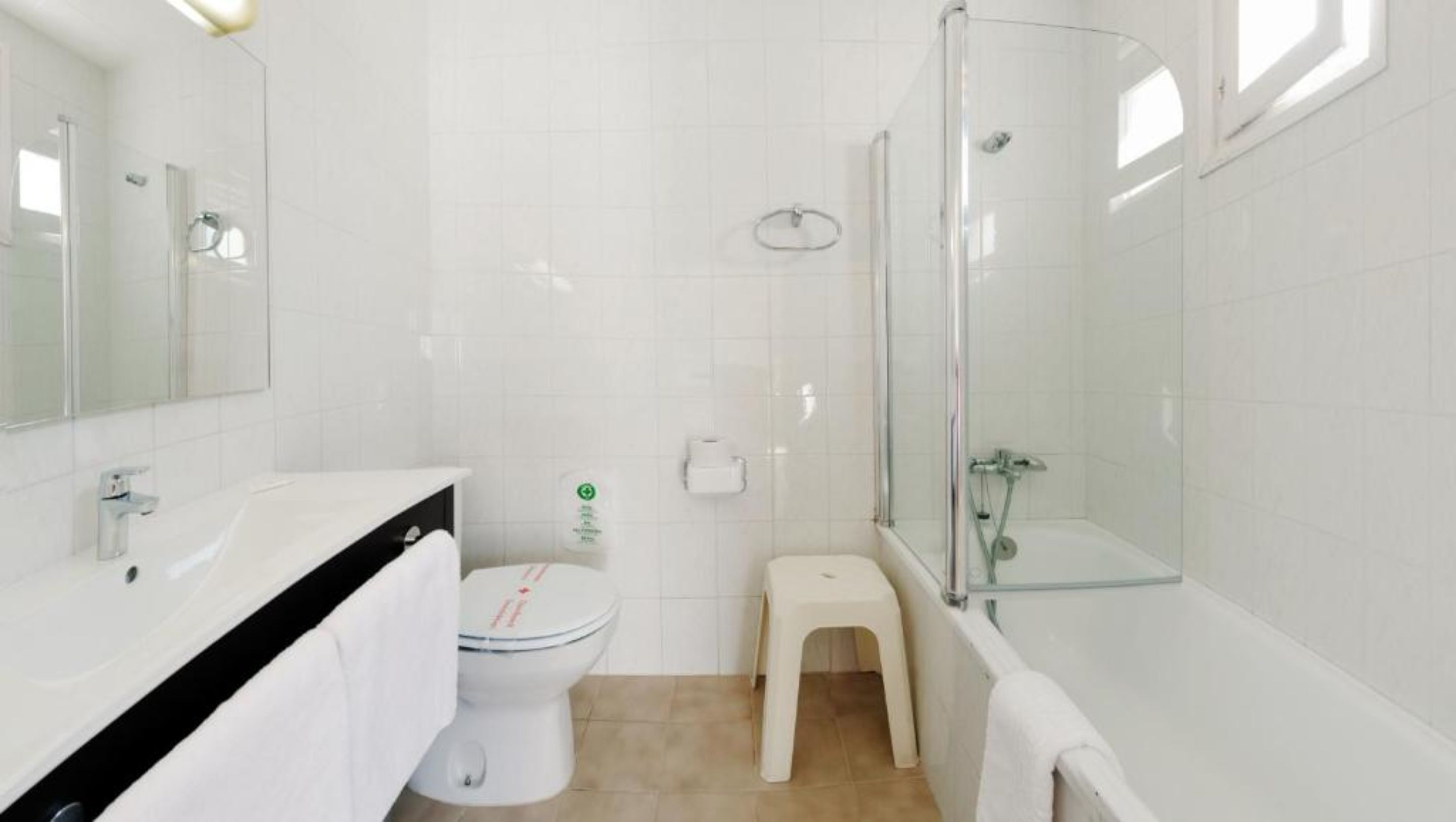 bathtub, free toiletries, hair dryer, towels