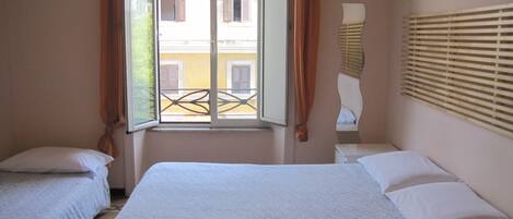 Triple Room (Private External Bathroom ) | Minibar, in-room safe, desk, iron/ironing board