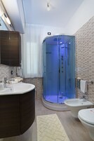 Superior Apartment, 1 Bedroom, Kitchenette, Ocean View | Bathroom | Rainfall showerhead, free toiletries, hair dryer, slippers